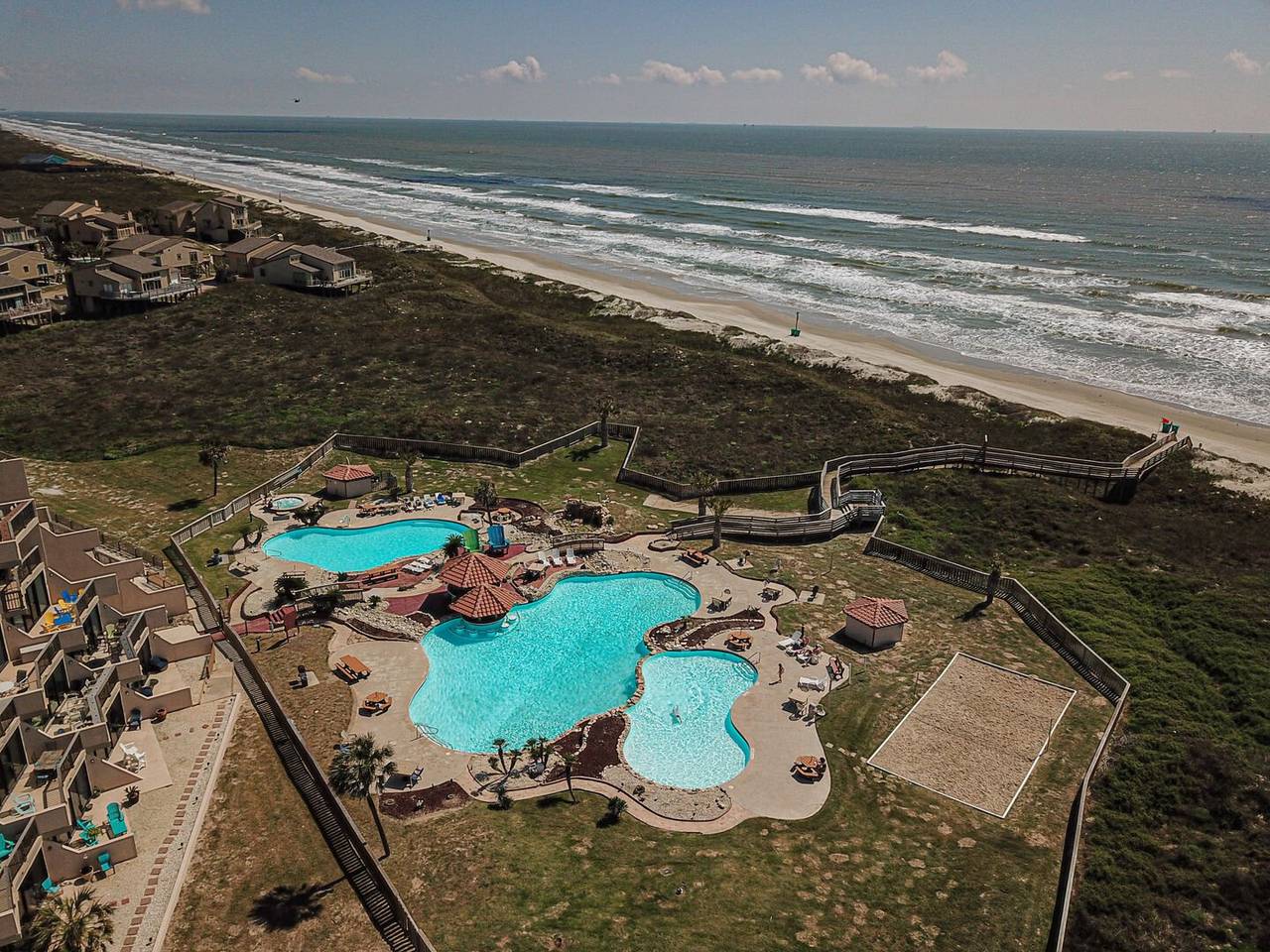 Aerial view of Mayan Princess lagoon pools and beach boardwalk